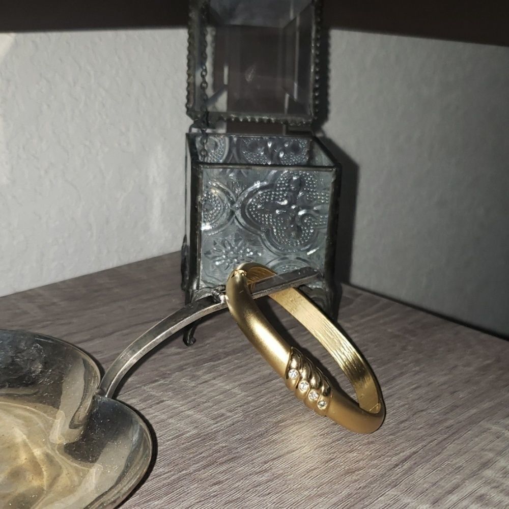 "5/$25" Goldtone hinged bangle bracelet
